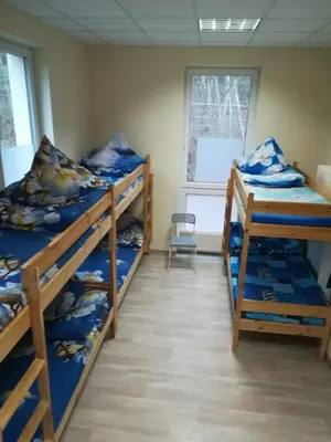 Łóżko lub łóżka w pokoju w obiekcie Lubelski Hostel - blisko Centrum Zdrowia Dziecka & Instytut Kardiologii