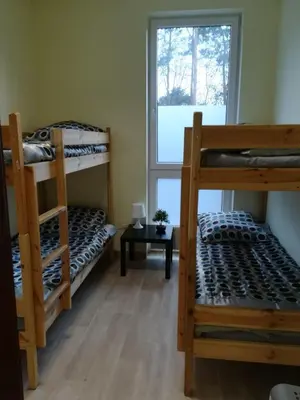 Łóżko lub łóżka w pokoju w obiekcie Lubelski Hostel - blisko Centrum Zdrowia Dziecka & Instytut Kardiologii