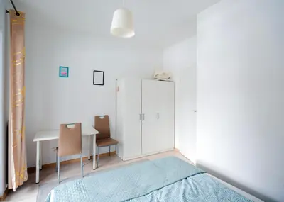 Łóżko lub łóżka w pokoju w obiekcie FIRST - Green Żoliborz Apartment 6