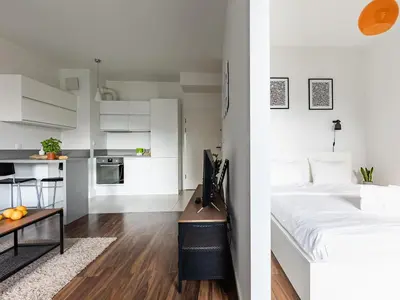 Łóżko lub łóżka w pokoju w obiekcie Kolejowa ApartHotel