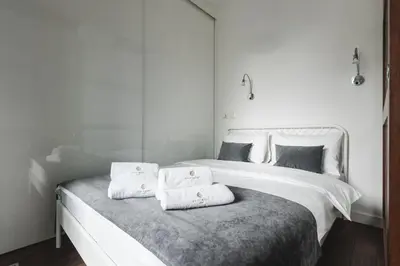 Łóżko lub łóżka w pokoju w obiekcie Kolejowa ApartHotel