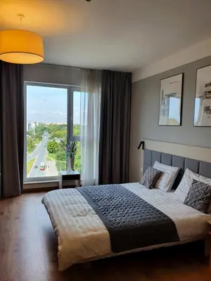 Łóżko lub łóżka w pokoju w obiekcie Warsaw Apartments - Luxury Top-view Aparthotel