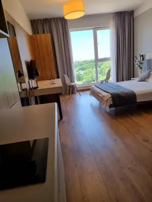 Łóżko lub łóżka w pokoju w obiekcie Warsaw Apartments - Luxury Top-view Aparthotel