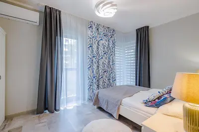 Łóżko lub łóżka w pokoju w obiekcie Family Apartment Żoliborz by Noclegi Renters