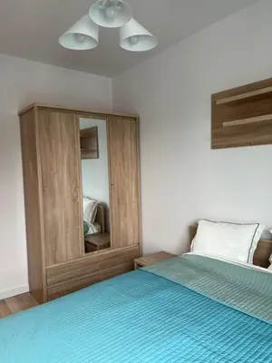 Łóżko lub łóżka w pokoju w obiekcie W Apartament , nowoczesny ,4 osobowy,