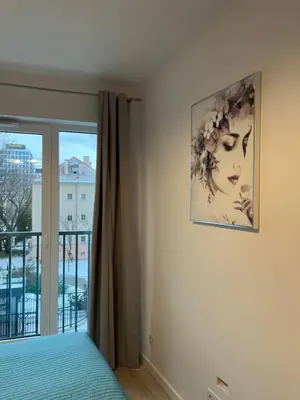 Łóżko lub łóżka w pokoju w obiekcie W Apartament , nowoczesny ,4 osobowy,