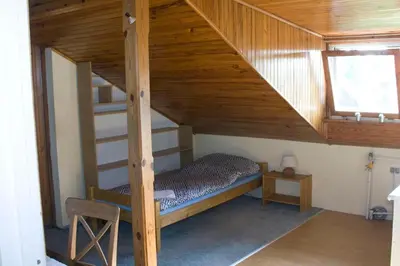Łóżko lub łóżka w pokoju w obiekcie HomeHostel