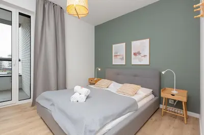 Łóżko lub łóżka w pokoju w obiekcie Artistic Żoliborz Apartments by Noclegi Renters