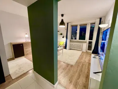 Łóżko lub łóżka w pokoju w obiekcie HOLIDAY metro fast WiFi TV’70 Netflix HBO AppleTV