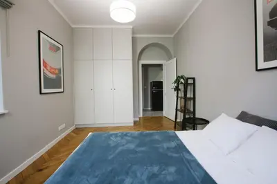 Łóżko lub łóżka w pokoju w obiekcie Warsaw Concierge Flat6 Hoza