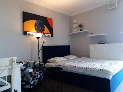 Łóżko lub łóżka w pokoju w obiekcie Apartament Pianista