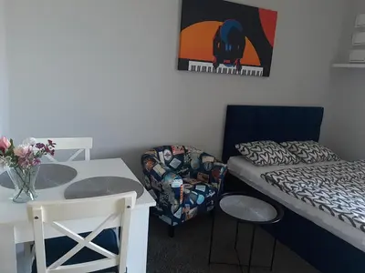 Łóżko lub łóżka w pokoju w obiekcie Apartament Pianista
