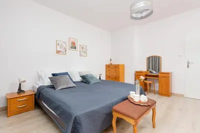 Łóżko lub łóżka w pokoju w obiekcie Duplex Apartment near the Airport by Noclegi Renters