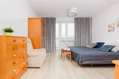 Łóżko lub łóżka w pokoju w obiekcie Duplex Apartment near the Airport by Noclegi Renters