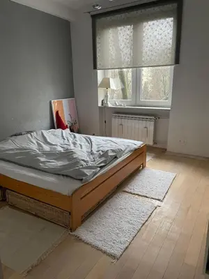 Łóżko lub łóżka w pokoju w obiekcie Apartament Koszykowa 1