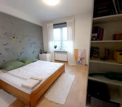 Łóżko lub łóżka w pokoju w obiekcie Apartament Koszykowa 1