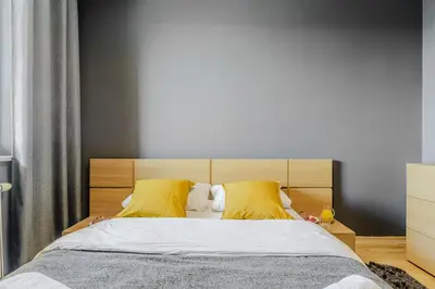 Łóżko lub łóżka w pokoju w obiekcie Apartament Ostrobramska - Praga Południe