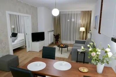 Łóżko lub łóżka w pokoju w obiekcie Kieślowskiego Apartment vis-a-vis Town Hall