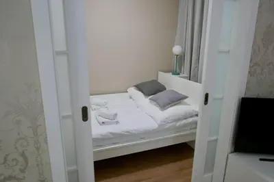 Łóżko lub łóżka w pokoju w obiekcie Kieślowskiego Apartment vis-a-vis Town Hall