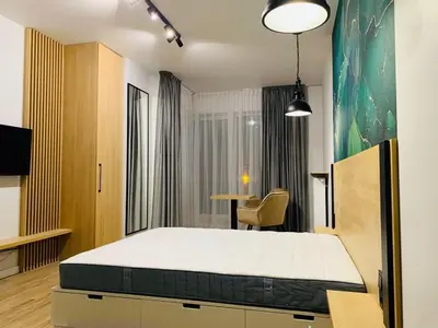 Łóżko lub łóżka w pokoju w obiekcie W Apartments