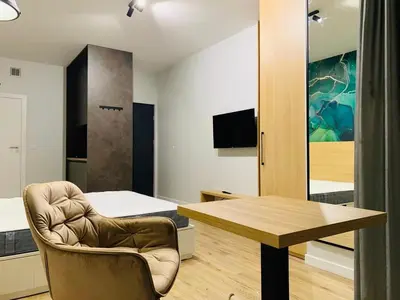 Telewizja i/lub zestaw kina domowego w obiekcie W Apartments