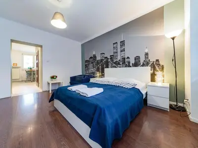 Łóżko lub łóżka w pokoju w obiekcie Nowogrodzka Cozy Studio II