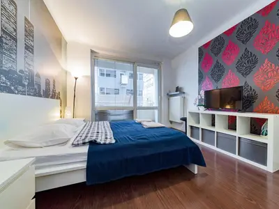 Łóżko lub łóżka w pokoju w obiekcie Nowogrodzka Cozy Studio II