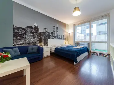 Łóżko lub łóżka w pokoju w obiekcie Nowogrodzka Cozy Studio II
