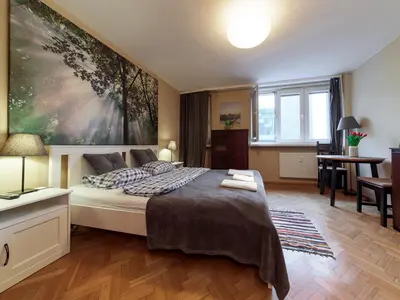 Łóżko lub łóżka w pokoju w obiekcie Sliska 10 apartament