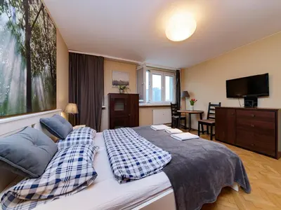 Łóżko lub łóżka w pokoju w obiekcie Sliska 10 apartament