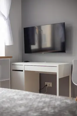 Telewizja i/lub zestaw kina domowego w obiekcie Elektoralna City Style Apartment by BookingHost