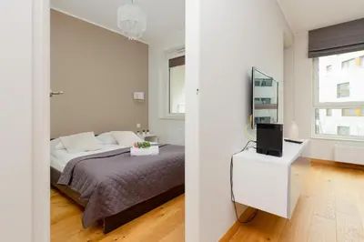 Łóżko lub łóżka w pokoju w obiekcie Kolorowy Gocław Apartment by Noclegi Renters