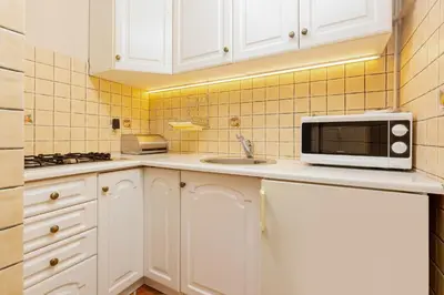 Kuchnia lub aneks kuchenny w obiekcie Studio Apartment Mokotów Malawskiego by Noclegi Renters