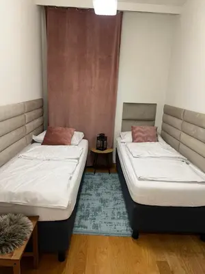Łóżko lub łóżka w pokoju w obiekcie Norblin Apart