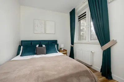 Łóżko lub łóżka w pokoju w obiekcie Apartment Rakowska Warsaw Włochy by Noclegi Renters