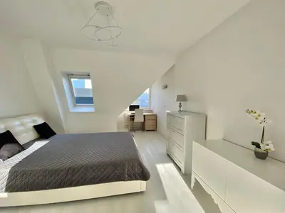 Łóżko lub łóżka w pokoju w obiekcie Penthouse 2 Bedroom Designer Apartment