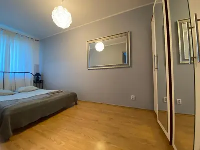 Łóżko lub łóżka w pokoju w obiekcie Apartamenty Łucka City