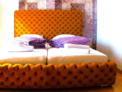 Łóżko lub łóżka w pokoju w obiekcie Ambassador Apartament