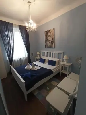 Łóżko lub łóżka w pokoju w obiekcie Chmielna Guest House