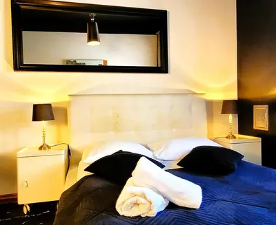 Łóżko lub łóżka w pokoju w obiekcie Chmielna Guest House