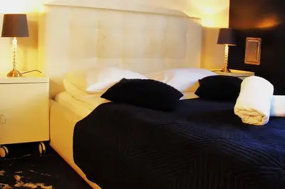 Łóżko lub łóżka w pokoju w obiekcie Chmielna Guest House