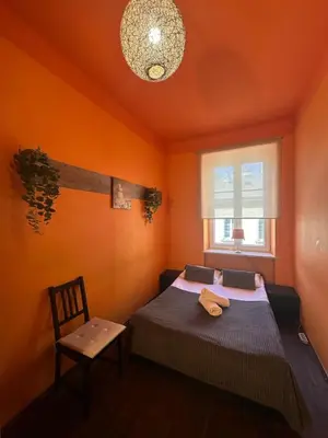 Łóżko lub łóżka w pokoju w obiekcie Chmielna Guest House