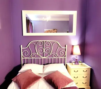 Łóżko lub łóżka w pokoju w obiekcie Chmielna Guest House