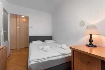 Łóżko lub łóżka w pokoju w obiekcie Apartament Emilii Plater by Your Freedom
