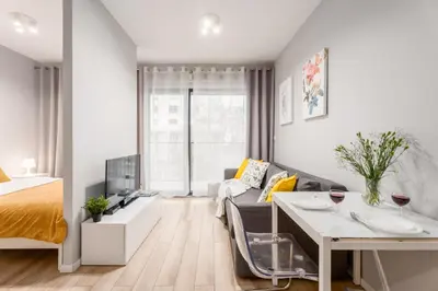 Łóżko lub łóżka w pokoju w obiekcie Arkadia City Apartments