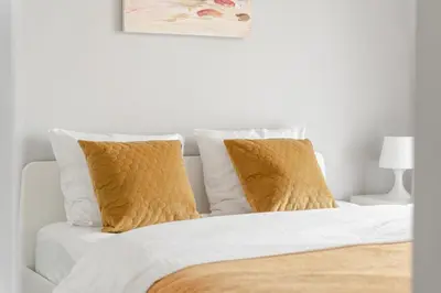 Łóżko lub łóżka w pokoju w obiekcie Arkadia City Apartments