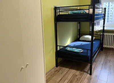 Łóżko lub łóżka w pokoju w obiekcie Hostel Oliwka - Metro Świętokrzyska