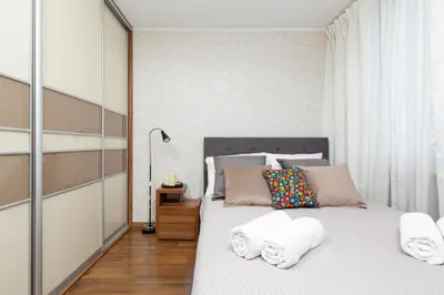 Łóżko lub łóżka w pokoju w obiekcie Family Apartment Saska Kępa by Noclegi Renters