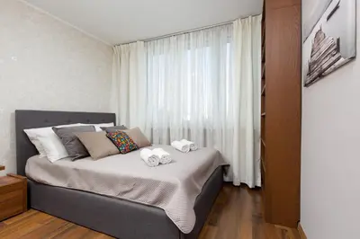 Łóżko lub łóżka w pokoju w obiekcie Family Apartment Saska Kępa by Noclegi Renters