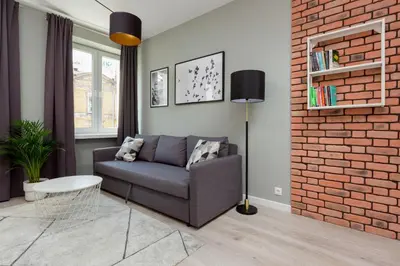 Część wypoczynkowa w obiekcie Central Apartment Emilii Plater by Noclegi Renters